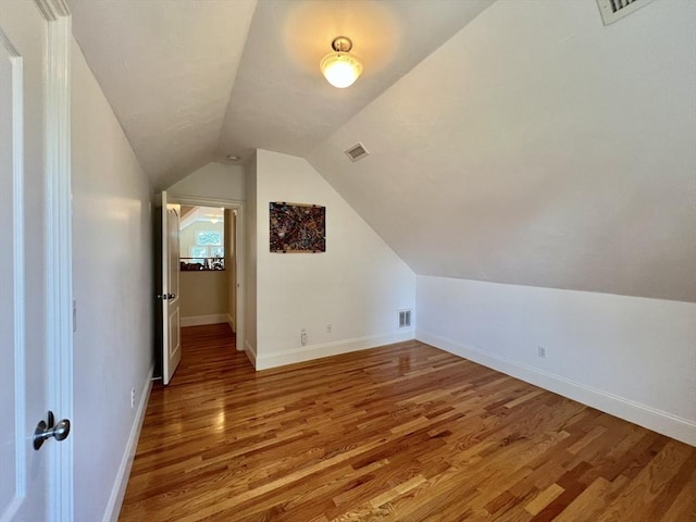 141 Pearl St Unit 141, Newton, MA 02458 - additional living space with light wood-type flooring and lofted ceiling