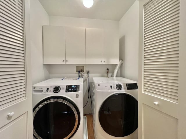 141 Pearl St Unit 141, Newton, MA 02458 - washroom with washer and dryer and cabinet space