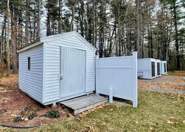 view of outbuilding with a lawn