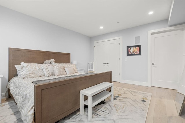 150 W Broadway Unit 203, Boston, MA 02127 - bedroom with light wood-style floors, recessed lighting, and a closet