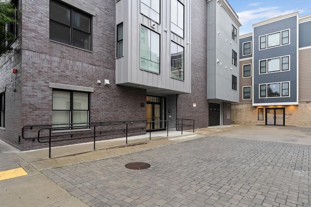 150 W Broadway Unit 203, Boston, MA 02127 - view of property featuring driveway and an attached garage