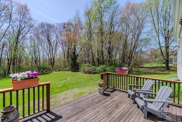 wooden terrace with a lawn