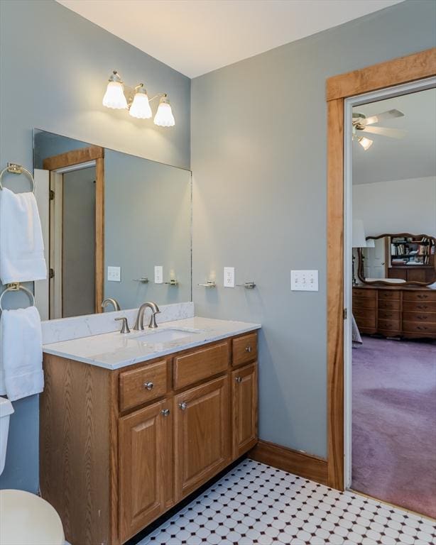 bathroom with vanity, ceiling fan, and toilet
