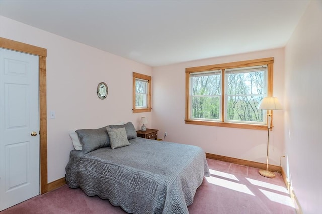 carpeted bedroom with baseboards