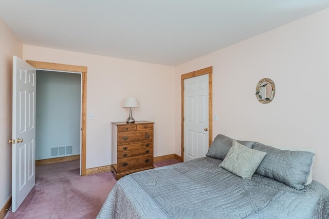 bedroom with visible vents, carpet flooring, and baseboards