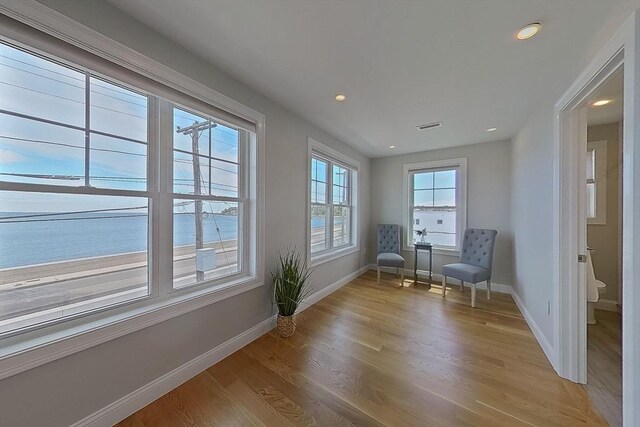 1089 Winthrop Ave, Revere, MA 02151 - living area featuring light wood finished floors, recessed lighting, and a water view