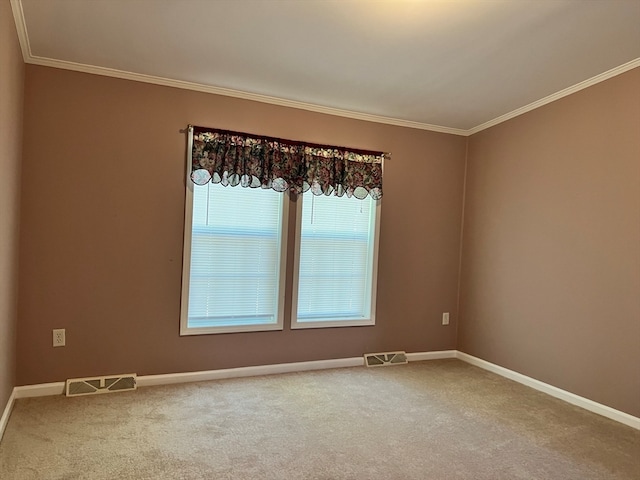 carpeted empty room with crown molding