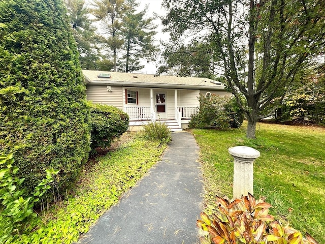 view of front of house featuring a front lawn and a porch