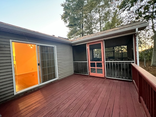 wooden terrace featuring a sunroom