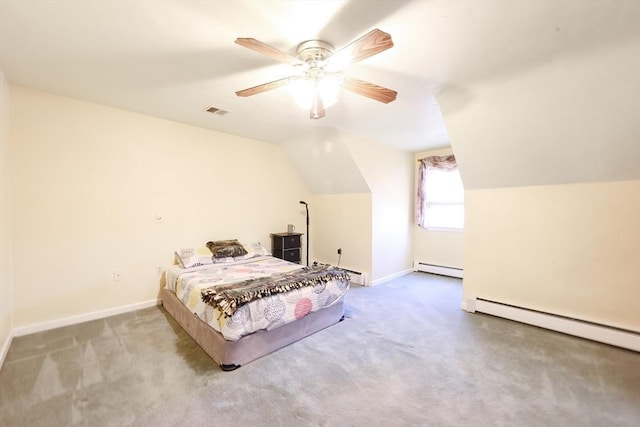 bedroom with vaulted ceiling, baseboard heating, baseboards, and carpet floors