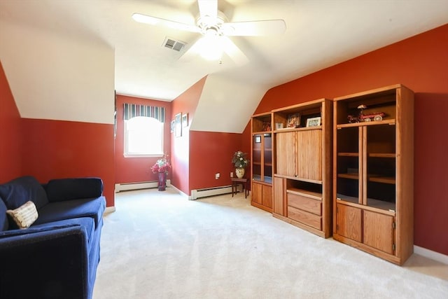 living room with visible vents, light colored carpet, a baseboard heating unit, and vaulted ceiling