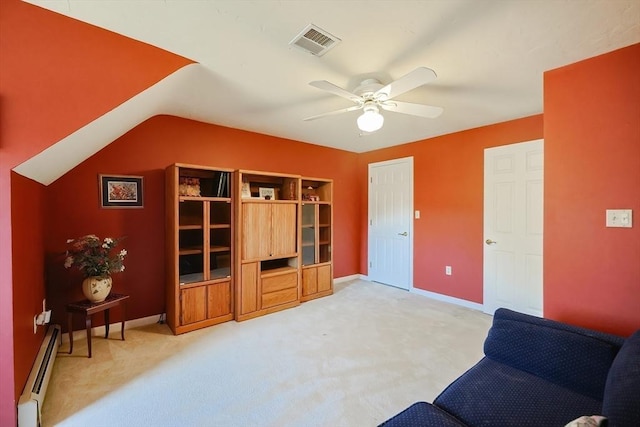 living area with baseboards, visible vents, ceiling fan, light carpet, and a baseboard heating unit