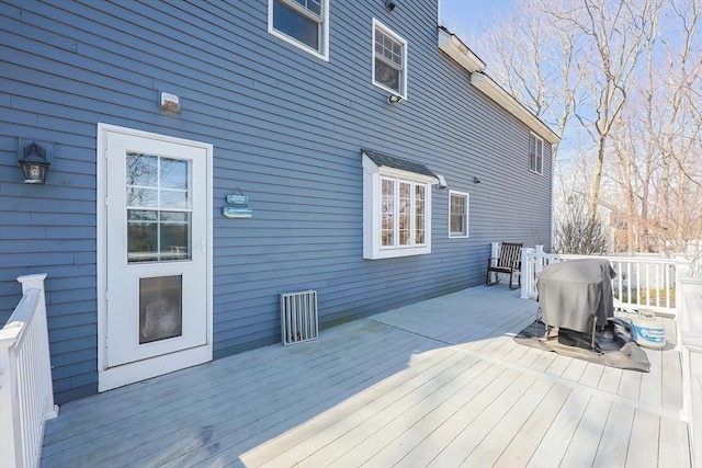 wooden terrace featuring area for grilling