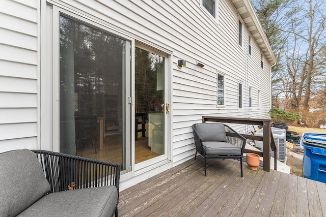 wooden terrace featuring central air condition unit