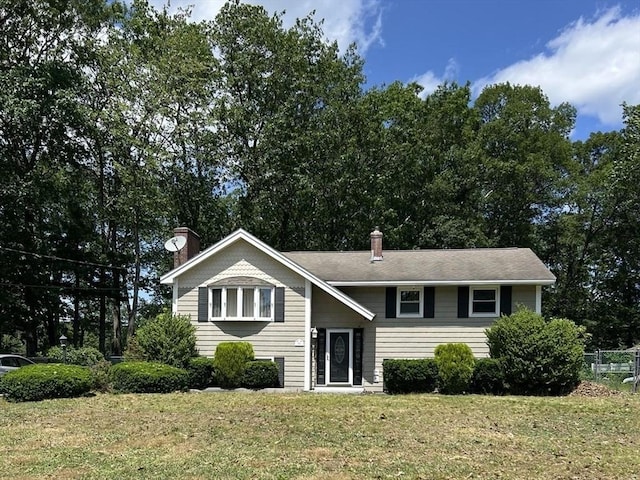 55 Alexander Ave, Dracut, MA 01826 - bi-level home with a chimney and a front lawn