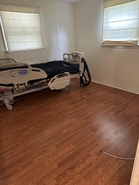 55 Alexander Ave, Dracut, MA 01826 - unfurnished room with wood finished floors and baseboards