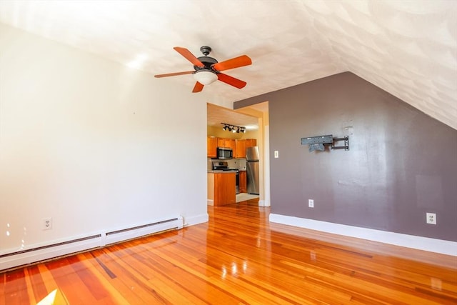 2A Hazel St Unit 3, Salem, MA 01970 - unfurnished living room featuring baseboard heating, light wood-type flooring, ceiling fan, baseboards, and vaulted ceiling