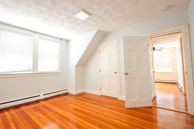 2A Hazel St Unit 3, Salem, MA 01970 - additional living space featuring a baseboard heating unit, healthy amount of natural light, and light wood-style flooring