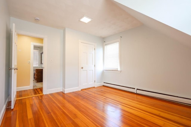 2A Hazel St Unit 3, Salem, MA 01970 - additional living space with wood finished floors, a baseboard heating unit, and baseboards
