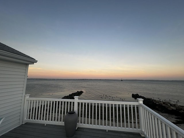 deck at dusk with a water view