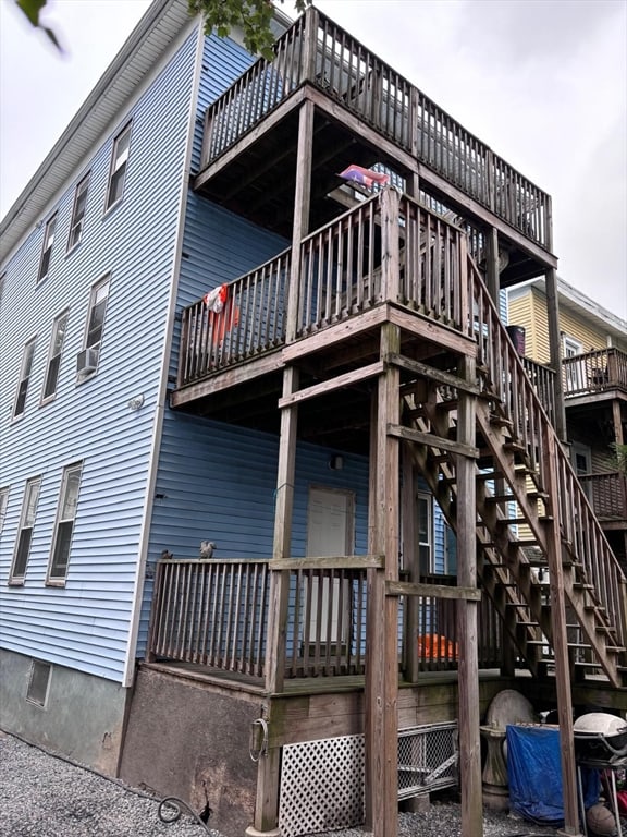 view of side of home with a deck