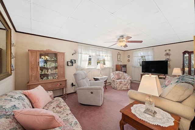 living room featuring crown molding, carpet, and ceiling fan