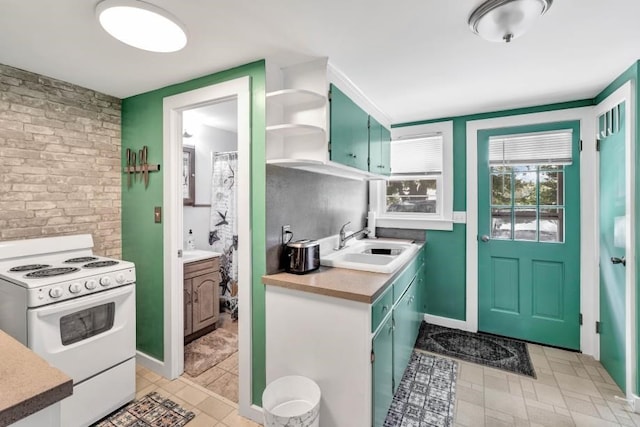 kitchen featuring white gas stove and sink