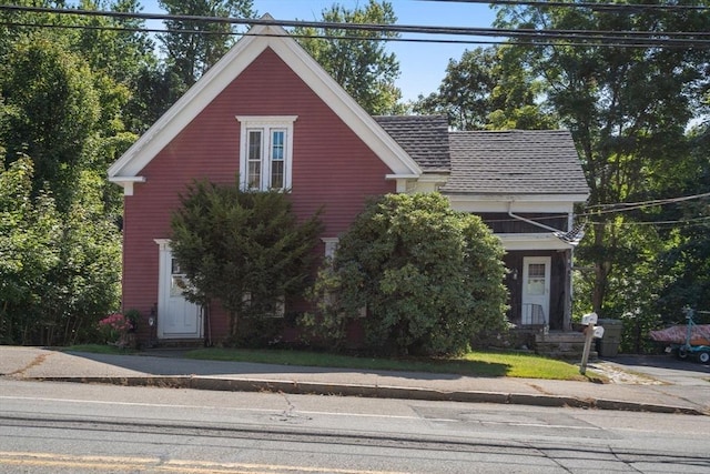 view of front of home with a shingled roof