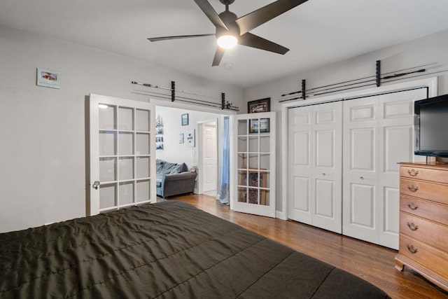 unfurnished bedroom featuring a closet, a ceiling fan, and wood finished floors