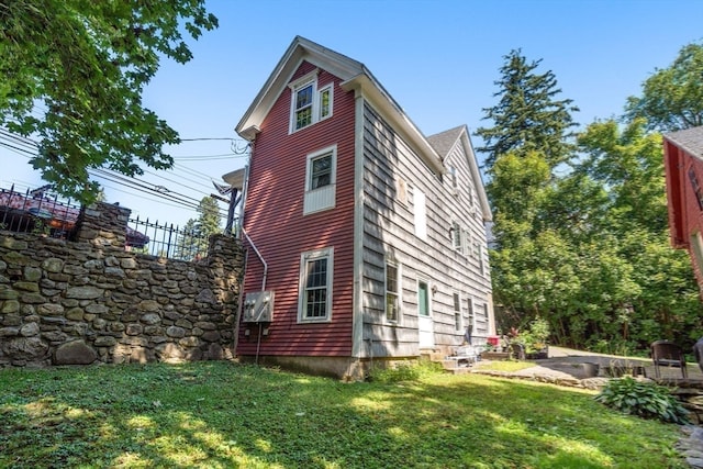 rear view of house with a lawn