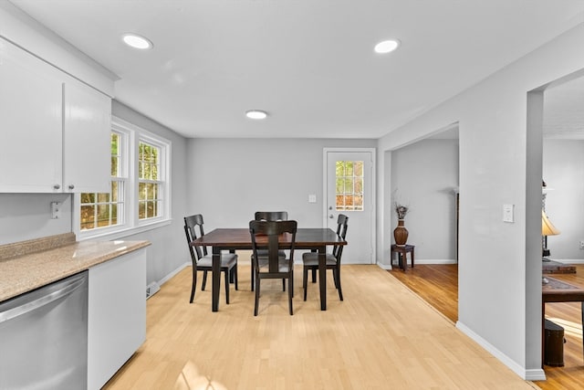 dining area featuring light wood-type flooring