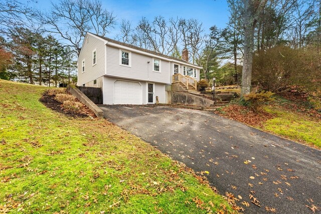 exterior space with a front lawn and a garage