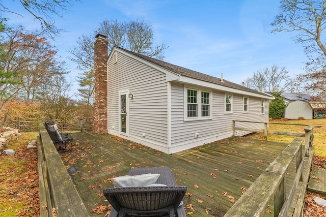 wooden terrace with a storage unit