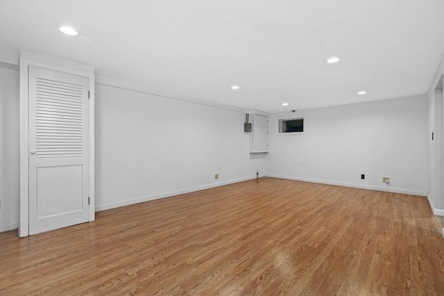 interior space featuring light wood finished floors, recessed lighting, and baseboards