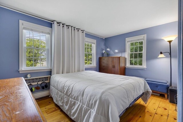 1230 Rte 149, Barnstable, MA 02648 - bedroom featuring hardwood / wood-style floors and a baseboard heating unit