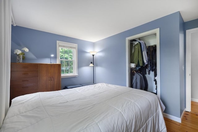 1230 Rte 149, Barnstable, MA 02648 - bedroom featuring wood finished floors, a closet, and baseboards