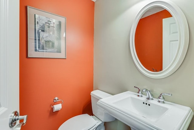 bathroom with sink and toilet