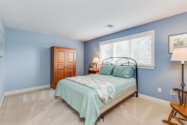 bedroom with light carpet