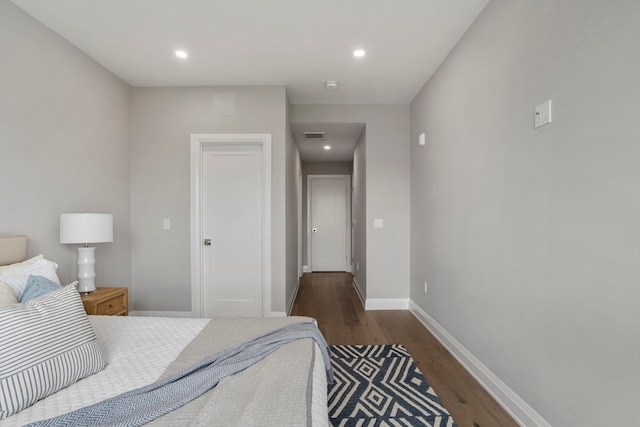 bedroom featuring dark hardwood / wood-style flooring