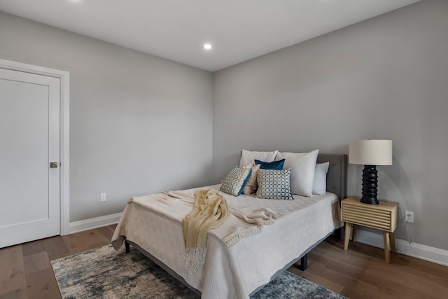 bedroom featuring dark hardwood / wood-style floors