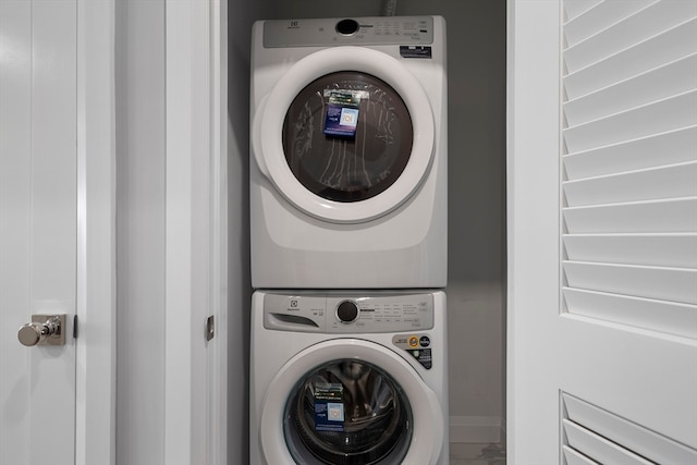 laundry area featuring stacked washer and dryer