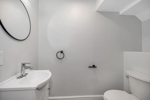 1514 Gorham St Unit 4, Lowell, MA 01852 - bathroom with toilet, vanity, and baseboards