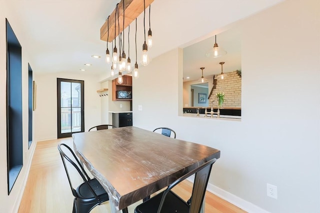 18 Carolina St, Medford, MA 02155 - dining area with light wood-style flooring, baseboards, and recessed lighting