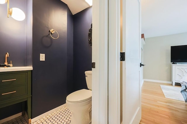 18 Carolina St, Medford, MA 02155 - bathroom featuring toilet, vanity, baseboards, and wood finished floors