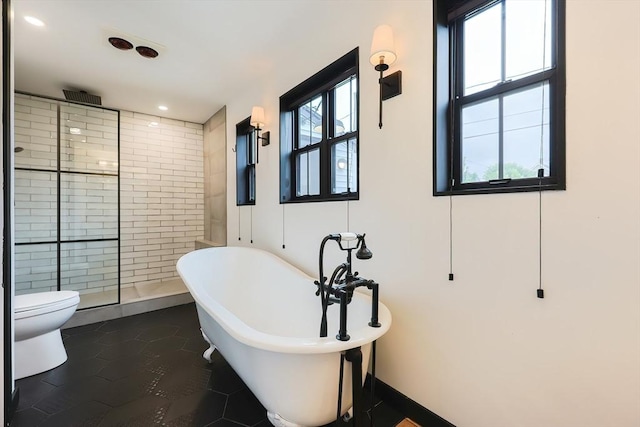 18 Carolina St, Medford, MA 02155 - bathroom featuring tiled shower, a freestanding tub, tile patterned flooring, toilet, and recessed lighting
