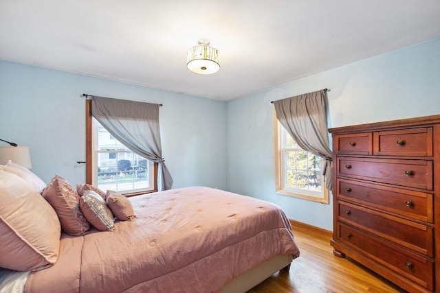 bedroom with light hardwood / wood-style flooring