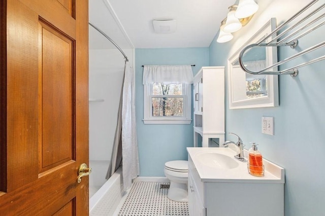 full bathroom featuring toilet, vanity, and shower / tub combo with curtain