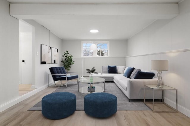 living room featuring hardwood / wood-style flooring and beamed ceiling