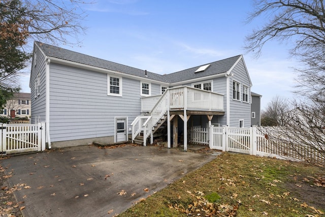 rear view of property with a deck