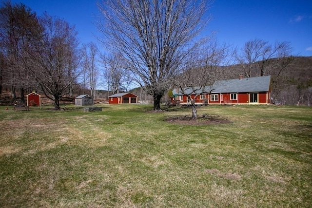 310 S River Rd, Charlemont, MA 01339 - view of yard with an outdoor structure and a storage shed